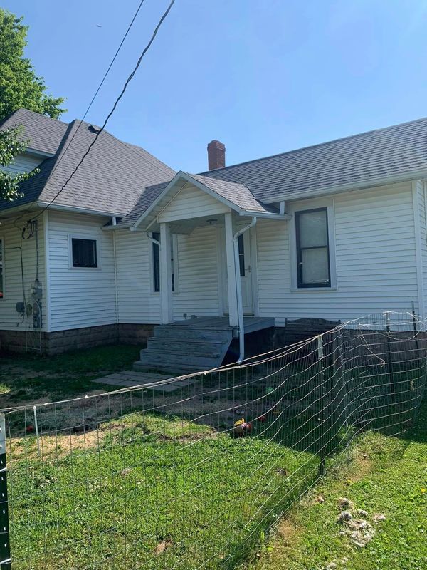 Before picture of a home that will be getting a wooden deck.