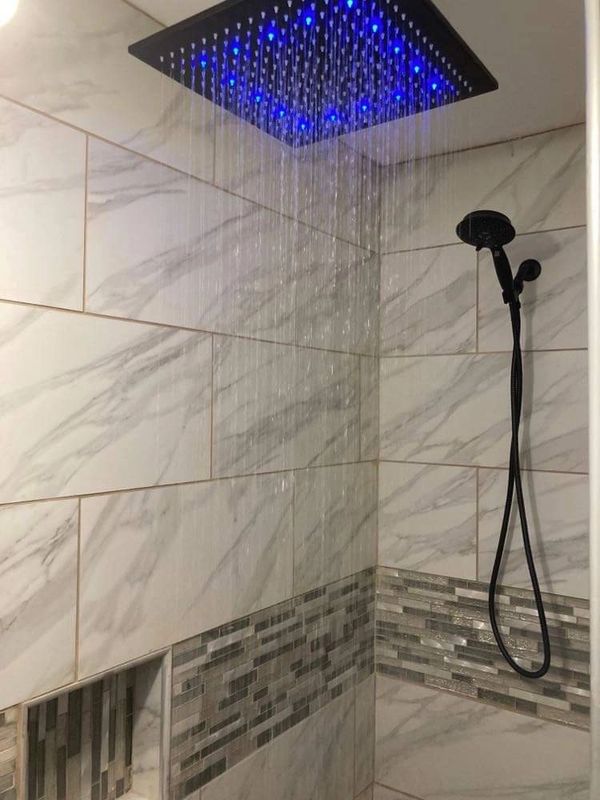 Beautiful custom stand-up shower with rain fall shower head and removable body shower head.
