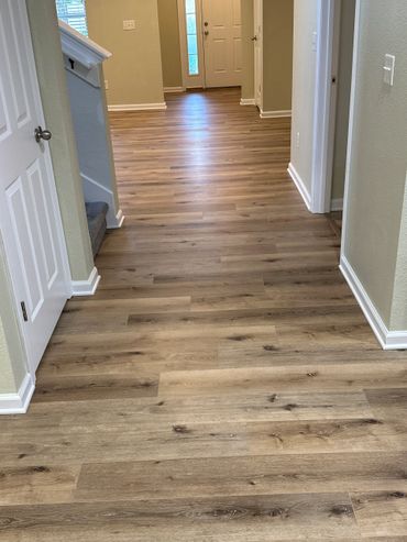 After picture of updated LVP flooring throughout home.