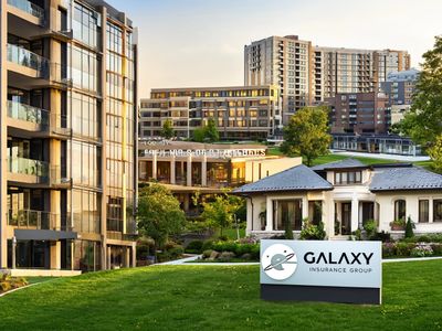 Modern office buildings and a house with a Galaxy Insurance Group sign in a green urban area. business insurance
insurance coverage
policy options for businesses