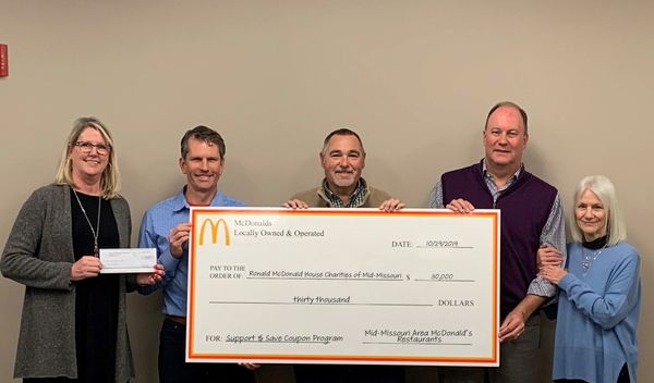 Local McDonald's Owner/Operators present RMHC of Mid-Missouri with a check for $30,000