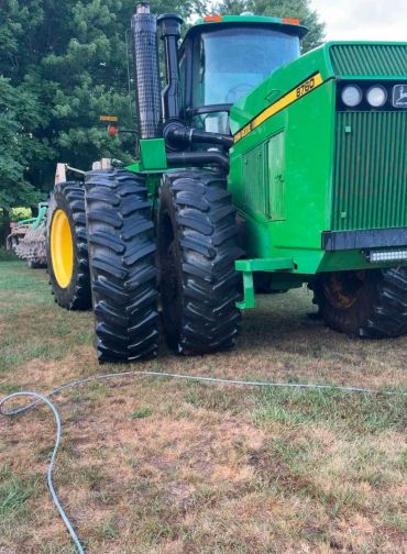 Large green John Deere tractor used for manure application in Northwest Ohio and Southeast Michigan by E&J Custom Ag Pumping.