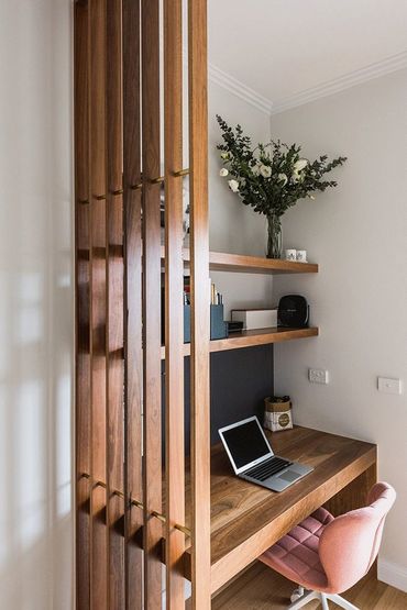 sleek wood desk and shelves, wood slate privacy wall. Ideal for small spaces, condos and apartments