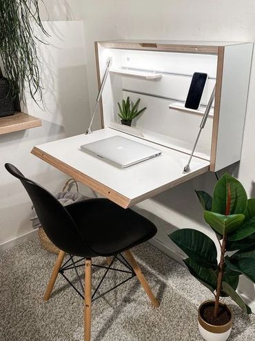 fold out desk with built in light. compact, versatile design for small spaces. perfect for condos