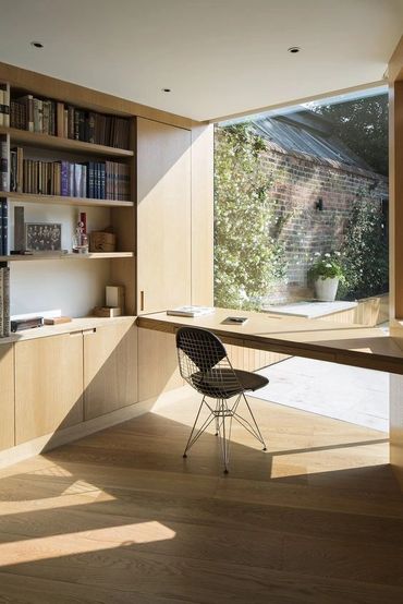minimalist office with floating desk and built in storage