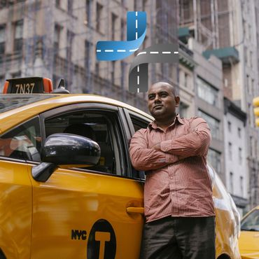 Confident taxi driver standing by his yellow NYC cab in the city.