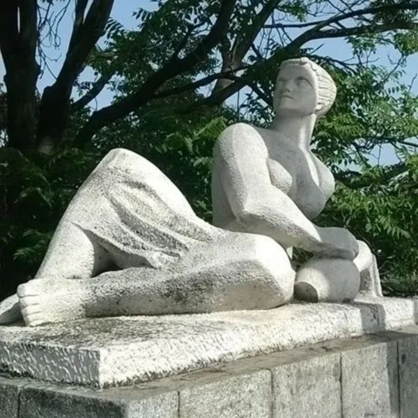 Statue of a reclining woman holding a pot.