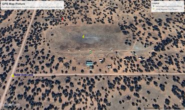 Aerial image of desert shooting range with scattered clay targets