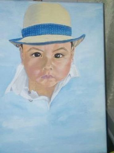 A young boy with his hat