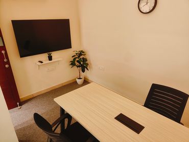 6 Seater conference room with state of the art 55 inch display. Supports both HDMI and wirless casti