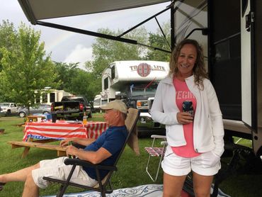 People hanging out at their camper