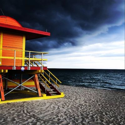 A lifeguard tower on a stormy beach.