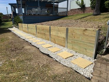 Retaining wall, with stepping tiles and stones