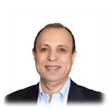 Smiling man in a dark blazer and light blue shirt against a white background.