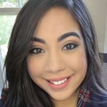 Headshot of Carmen Nahir Medina. Hispanic female with long, straight dark hair.