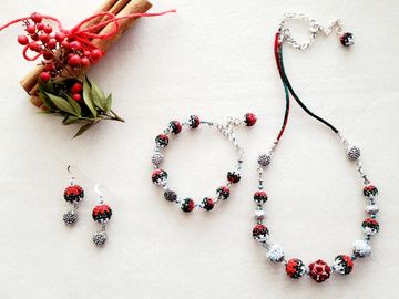 Rose and clay beads, Egyptian glass rhinestone beads, crystals and silver snowflake beads.