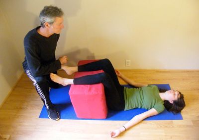 Owner Jeff using posture therapy with client