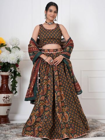 Woman in traditional ethnic attire with a printed lehenga and dupatta.