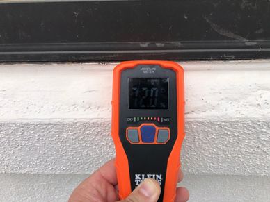 Warranty phase inspection showing moisture-damaged stucco veneer.