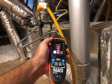 Final phase inspection showing a gas leak detector indicating a gas leak at the furnace.