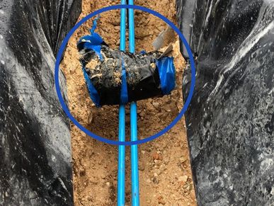 Foundation pre-pour inspection showing post-tension cables in contact with plumbing drains