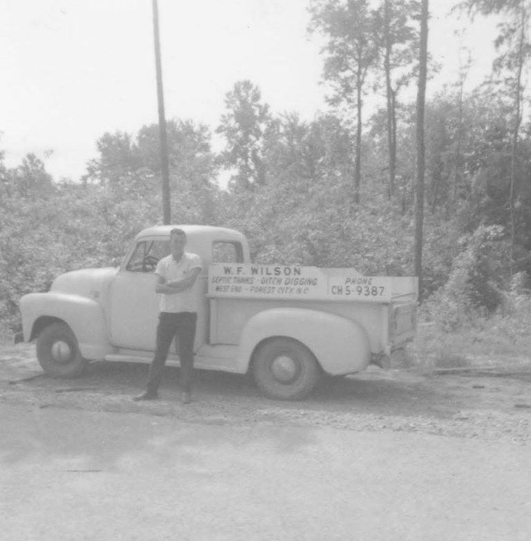 Founder WF Wilson in front of his first service truck
