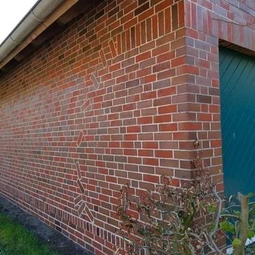 Expert brickwork detailing on custom garden wall built in Buckhurst Hill.