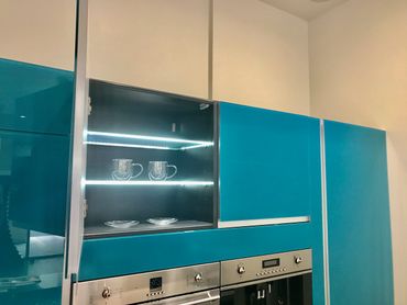 GLASS DOORS IN BLUE TURQUOISE WITH BACK LED GLASS SHELVES