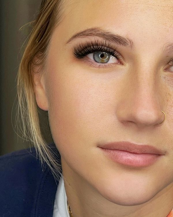 Hybrid lash extensions on green eyes — soft volume and definition at a Jupiter, FL lash studio.
