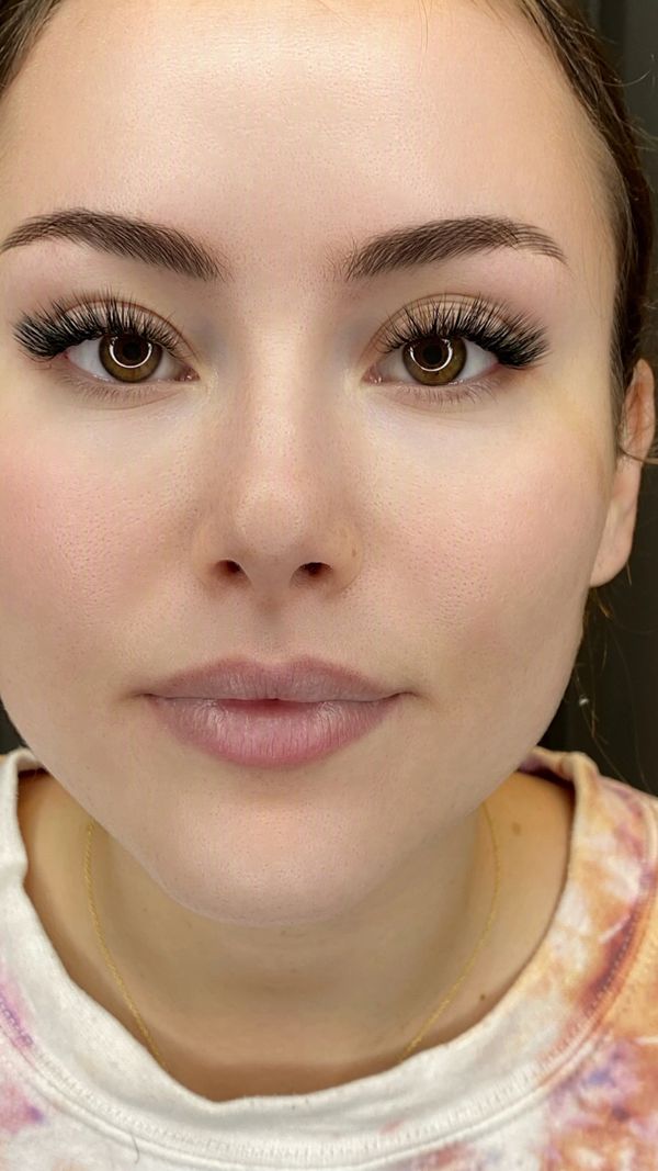Siren cat eye lash extensions on brown eyes — lifted, elongated look at a Jupiter, FL lash studio.