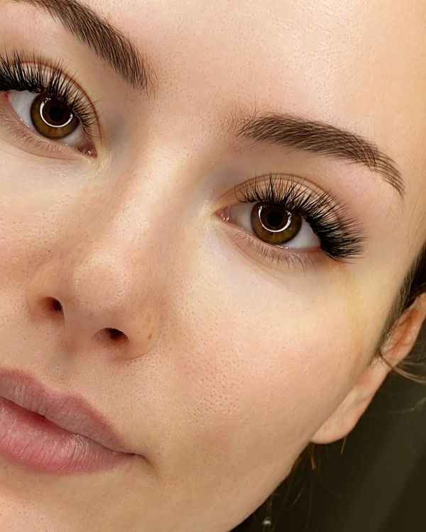 Stunning hybrid cat eye lash extensions on brown  eyes — soft, lifted look at a Jupiter, FL lash stu