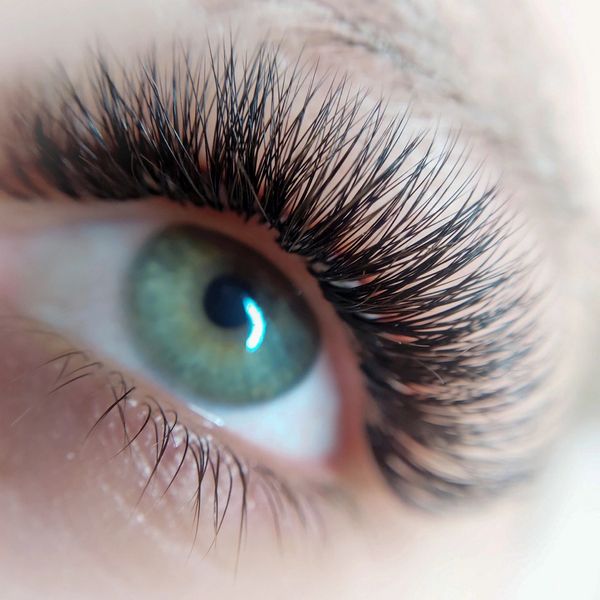 Close-up of a blue eye with volume lash extensions — bold, best lashes at a Jupiter, FL lash studio.