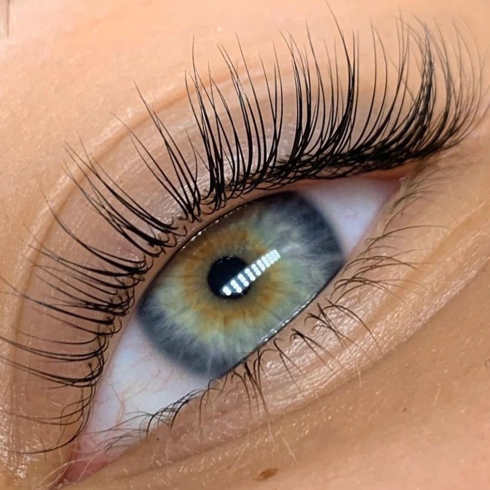 Close-up of an eye with beautifully laminated lashes.