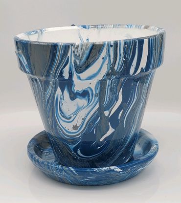 Blue and white marbled ceramic flower pot with matching saucer.