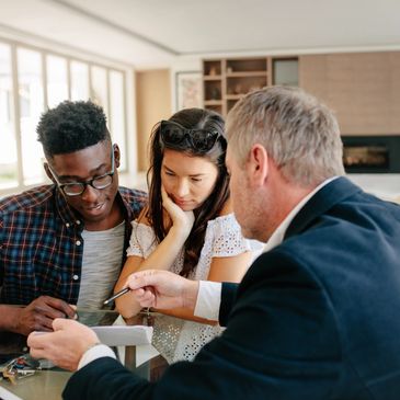 A couple in a meeting with a mortgage adviser