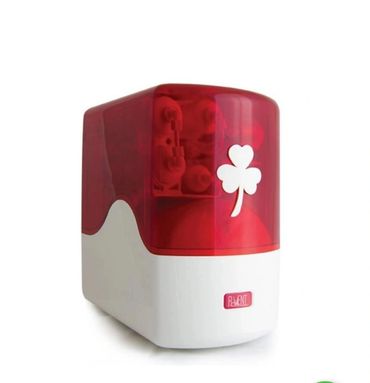 Compact red and white appliance with a clover design on the front.