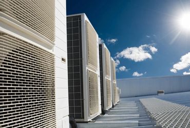 a roof of building with multi dubel HVAC