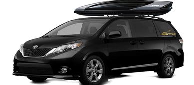 Black Toyota minivan with roof cargo box.