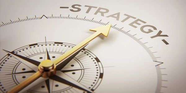 Golden compass arrow pointing to the word 'Strategy'.
