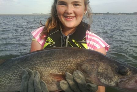 Girl holding walleye