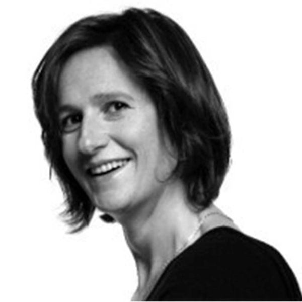 Black-and-white portrait of a smiling woman with short hair.