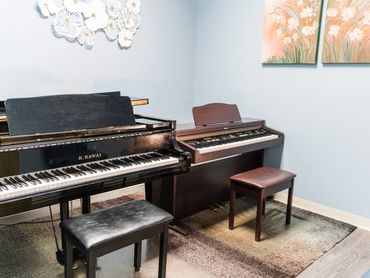 Quiet piano practice room designed for student learning and performance prep.