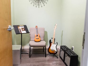 ozy teaching space for guitar, bass, and ukulele lessons at Artistry Academy.