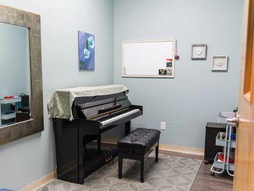 Voice lesson room with piano accompaniment at Artistry Academy Music & Art.
