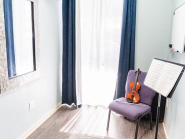 Teaching room for violin, cello, and viola lessons at Artistry Academy Music & Art.