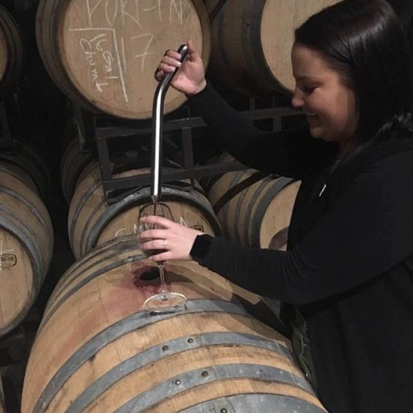 The Somm of Dammi Vino Franklin TN Theiving from wine barrel for Dammi Vino Wine Event Wine Class
