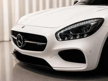 Close-up of white Mercedes-Benz car front.
