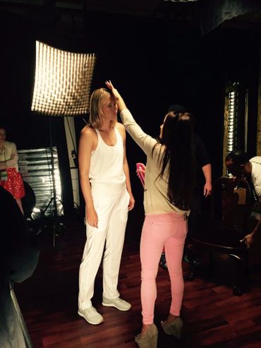 Vita Krafty adjusting model's hair for commercial