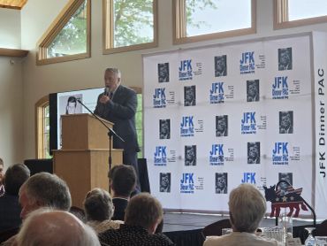 Rep. Gregg Johnson speaking at JFK Dinner PAC event with audience