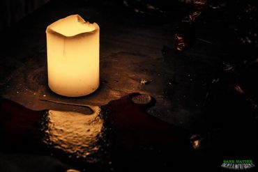 Candle Surrounded by Blood